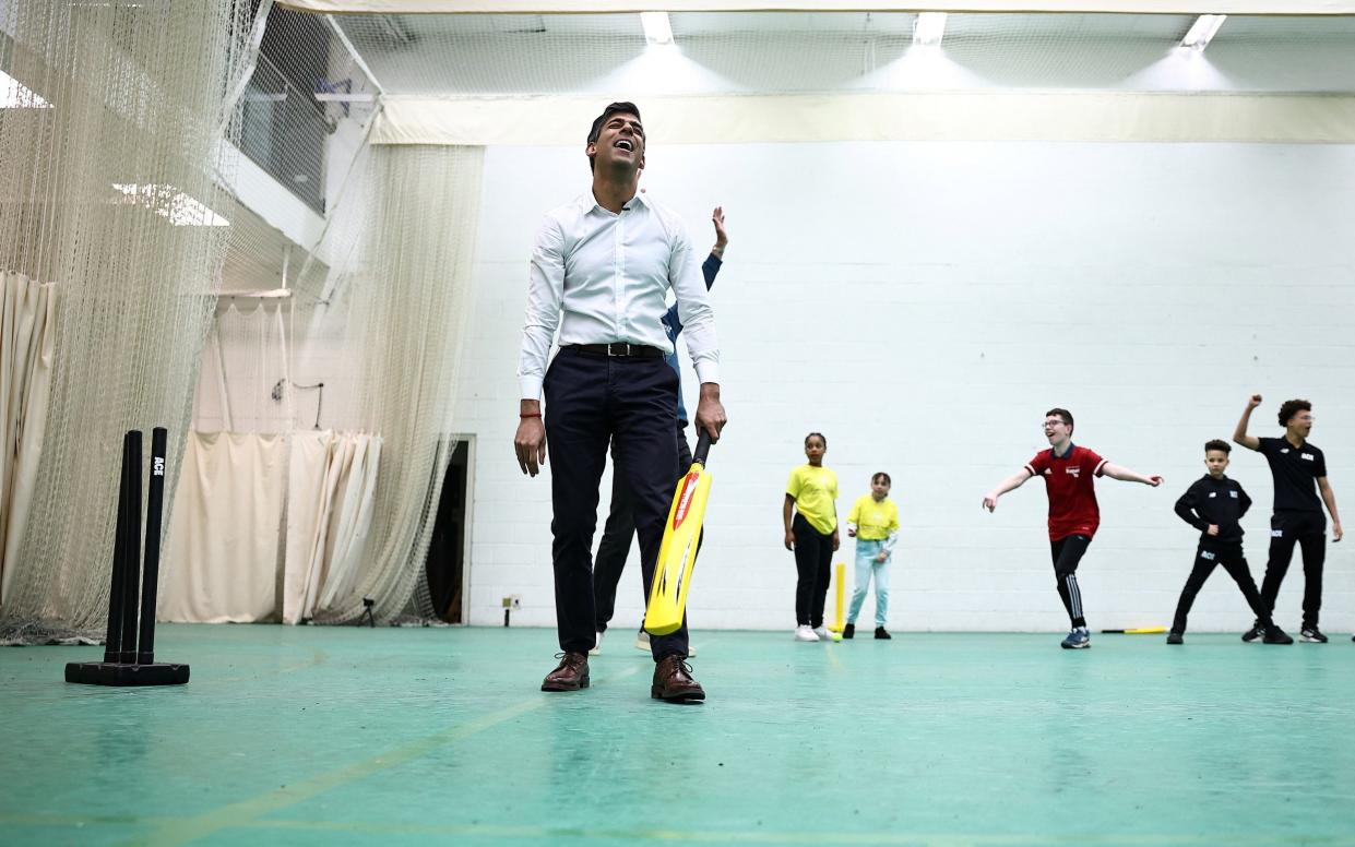 Children celebrate their win as the Prime Minister realises he is out of the game