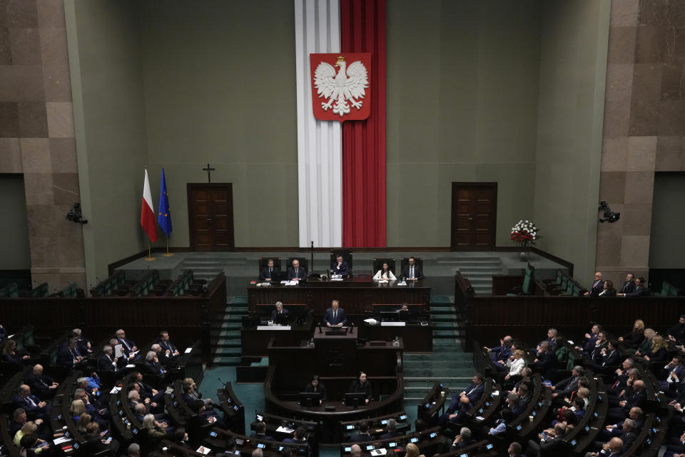 Newly elected Poland's Prime Minister Donald Tusk addresses lawmakers during his speech at the parliament in Warsaw, Poland, Tuesday Dec. 12, 2023. (AP Photo/Czarek Sokolowski)