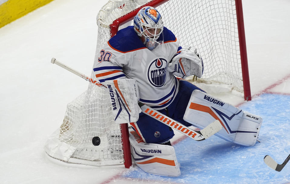 Edmonton Oilers goaltender Calvin Pickard stops a Colorado Avalanche shot during the third period of an NHL hockey game Thursday, April 18, 2024, in Denver. (AP Photo/David Zalubowski)