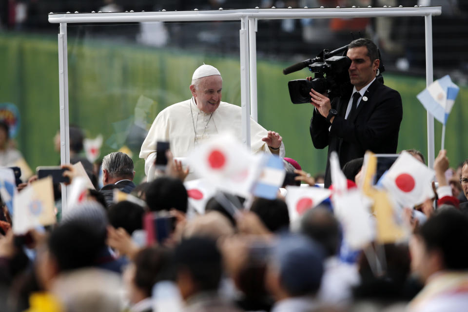Pope Francis waves in his popemobile as he celebrates a Mass at Nagasaki Prefectural Baseball Stadium, Sunday, Nov. 24, 2019, in Nagasaki, Japan. (AP Photo/Kiichiro Sato)