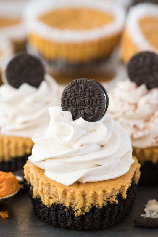 <p>The First Year</p><p>This easy Thanksgiving cheesecake can be made with a oreo crust or a graham cracker crust. Top these pumpkin cheesecake cupcakes with our homemade pumpkin whipped cream.</p><p><strong>Get the recipe: <a href="https://thefirstyearblog.com/mini-pumpkin-cheesecakes-with-oreo-crust/" rel="nofollow noopener" target="_blank" data-ylk="slk:Mini Pumpkin Cheesecakes with Oreo Crust;elm:context_link;itc:0;sec:content-canvas" class="link ">Mini Pumpkin Cheesecakes with Oreo Crust</a></strong></p>