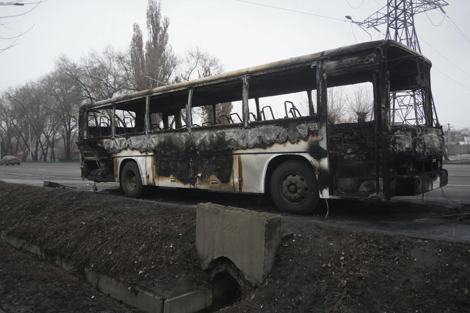 A bus, which was burned during clashes, is seen on a street in Almaty, Kazakhstan, Sunday, Jan. 9, 2022. Kazakhstan's health ministry says 164 people have been killed in protests that have rocked the country over the past week. President Kassym-Jomart Tokayev's office said Sunday that order has stabilized in the country and that authorities have regained control of administrative buildings that were occupied by protesters, some of which were set on fire. (Vladimir Tretyakov/NUR.KZ via AP)