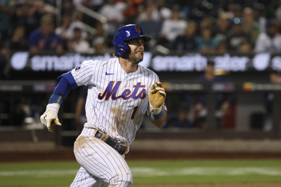 New York Mets' Jeff McNeil runs after hitting an RBI triple against the Seattle Mariners during the eighth inning of a baseball game Saturday, Sept. 2, 2023, in New York. (AP Photo/Jason DeCrow)