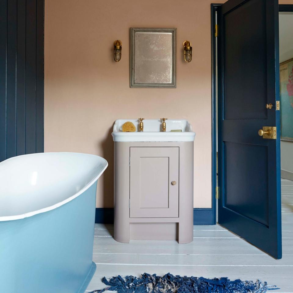 Bathroom by Nicola Harding, painted in Farrow & Ball’s Pink Ground; cabinet in Smoked Trout and woodwork in Hague Blue