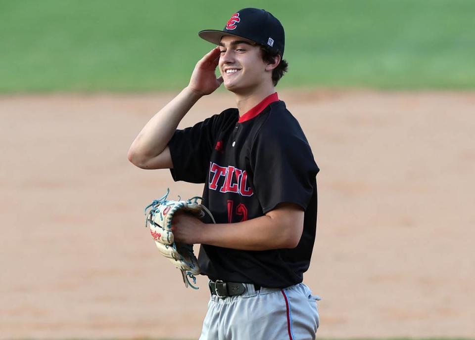 Charlotte Catholic’s pitcher Mason Child glances toward the team dugout and smiles during action against Providence High on Thursday, May 2, 2024 in the Southwestern 4A Championship game at Granger High School. Catholic defeated Providence 6-4.