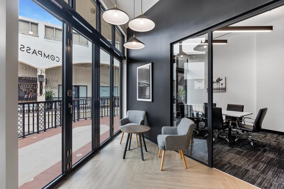 Compass Florida's new second-floor office overlooks the interior courtyard of The Esplanade on Worth Avenue in Palm Beach. The real estate agency was previously located across town on Sunrise Avenue.