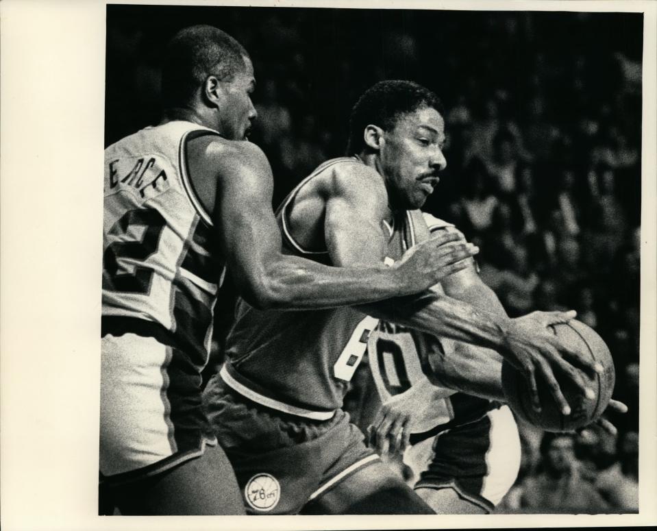 Philadelphia's Julius Erving drove past Ricky Pierce of the Bucks Wednesday night. Milwaukee blasted the 76ers, 128-95