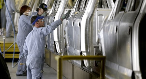 FILE - In this March 13, 2015 file photo, workers inspect the new aluminum-alloy body Ford F-150 trucks before they get painted at the company's Kansas City Assembly Plant in Claycomo, Mo. The Commerce Department releases its September report on durable goods on Tuesday, Oct. 27, 2015. (AP Photo/Charlie Riedel, File)