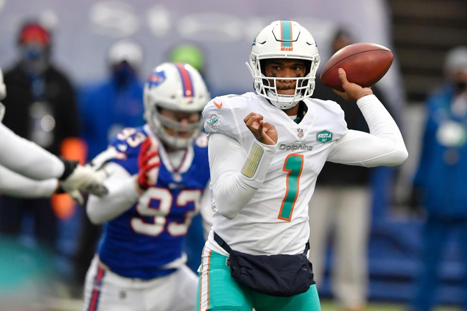 Miami Dolphins quarterback Tua Tagovailoa passes in the first half of an NFL football game against the Buffalo Bills, Sunday, Jan. 3, 2021, in Orchard Park, N.Y.