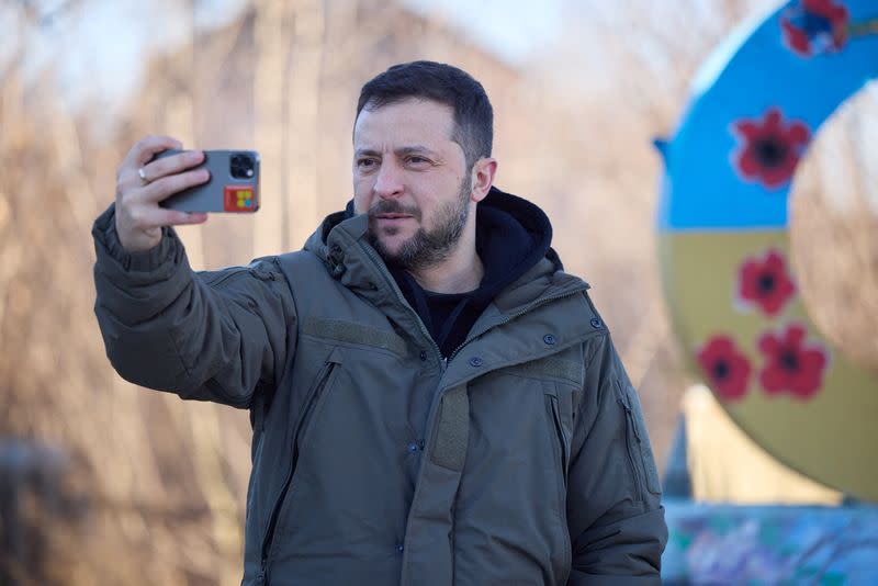 Ukraine’s President Zelenskiy captures a video to congratulate the Ukrainian Armed Forces amid Russia’s attack on Ukraine, near the town of Sloviansk