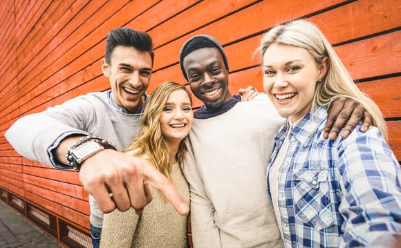 A group of young people smiling.