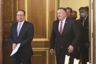 US Secretary of State Mike Pompeo, center left, attends a joint news conference with Austrian Foreign Minister Alexander Schallenberg, center right, in Vienna, Austria, Friday, Aug. 14, 2020. Pompeo is on a five-day visit to central Europe. (AP Photo/Ronald Zak)