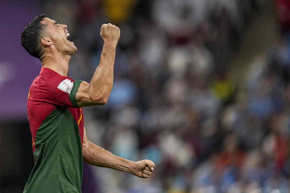 Portugal's Cristiano Ronaldo celebrates after scoring his side's opening goal during the World Cup group H soccer match between Portugal and Uruguay, at the Lusail Stadium in Lusail, Qatar, Monday, Nov. 28, 2022. (AP Photo/Abbie Parr)