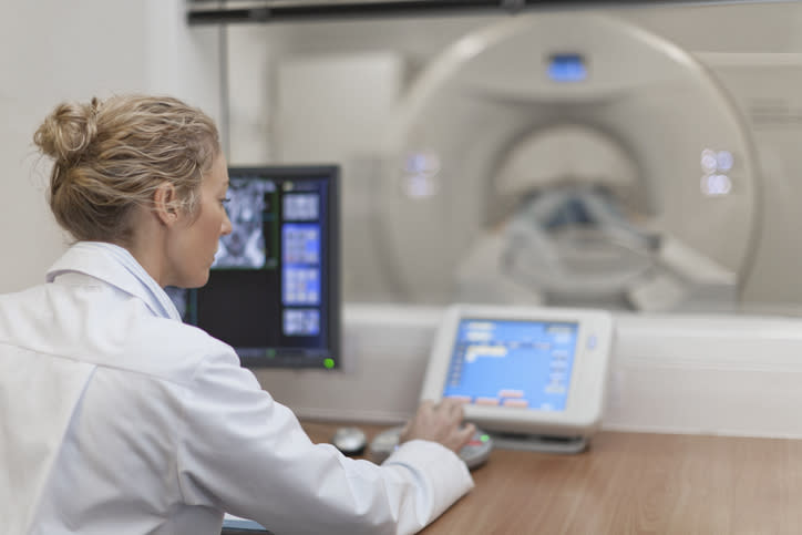 A CT scan operator working