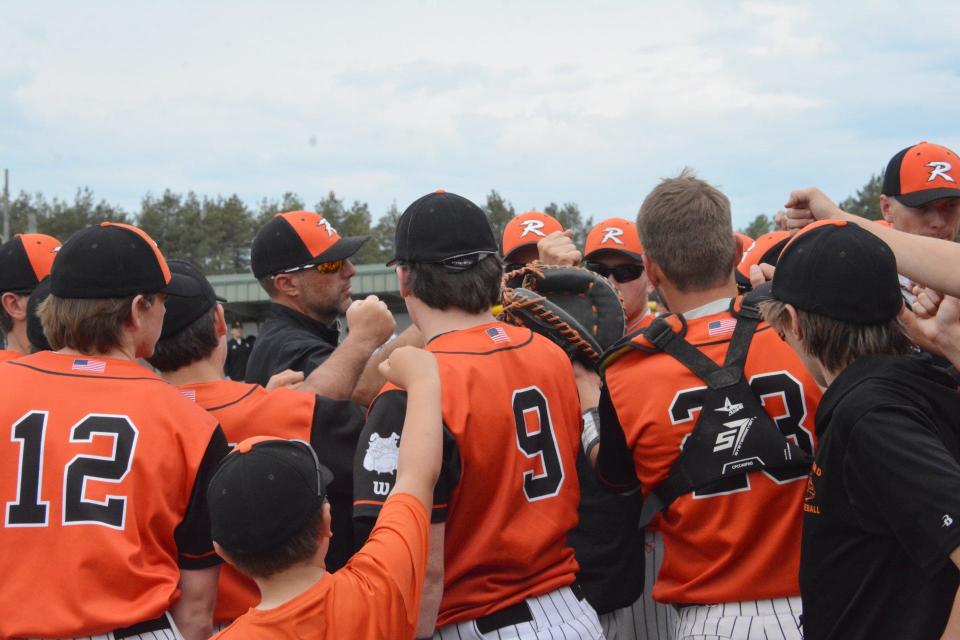 Rudyard baseball players gather around coach Billy Mitchell during a quarterfinal game at Lions Field. Mitchell is one of the coaches for the MHBCA All-Star Game at Comerica Park Monday.