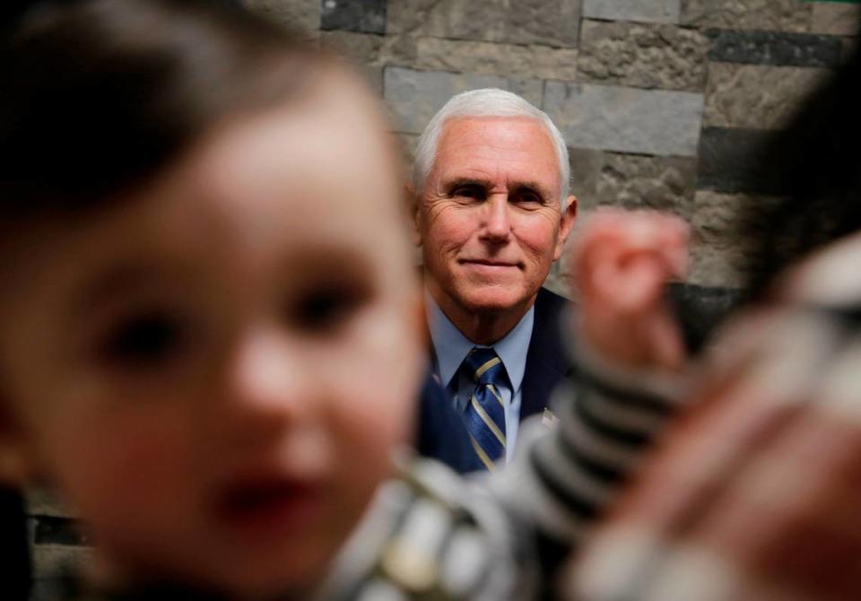 Former Vice-President Mike Pence talks to a family Tuesday at Garden Sanctuary Church of God in Rock Hill, S.C.