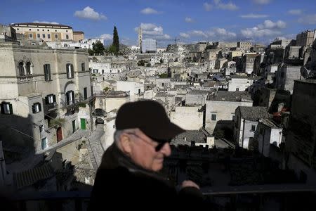 A man stands at a viewpoint from where he can see Matera's Sassi, southern Italy April 29, 2015. REUTERS/Tony Gentile