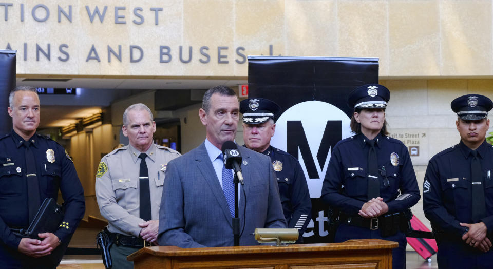 The Transportation Security Administration (TSA) administrator David P. Pekoske, center, talks during a news conference in Los Angeles' Union Station on Tuesday, Aug. 14, 2018. Pekoske talked about the ThruVision detection technology that reveals suspicious objects on people. Aiming to stay ahead of an evolving threat against transit systems worldwide, officials in Los Angeles are testing out the airport-style body scanners that screen subway passengers for firearms and explosives. (AP Photo/Richard Vogel)