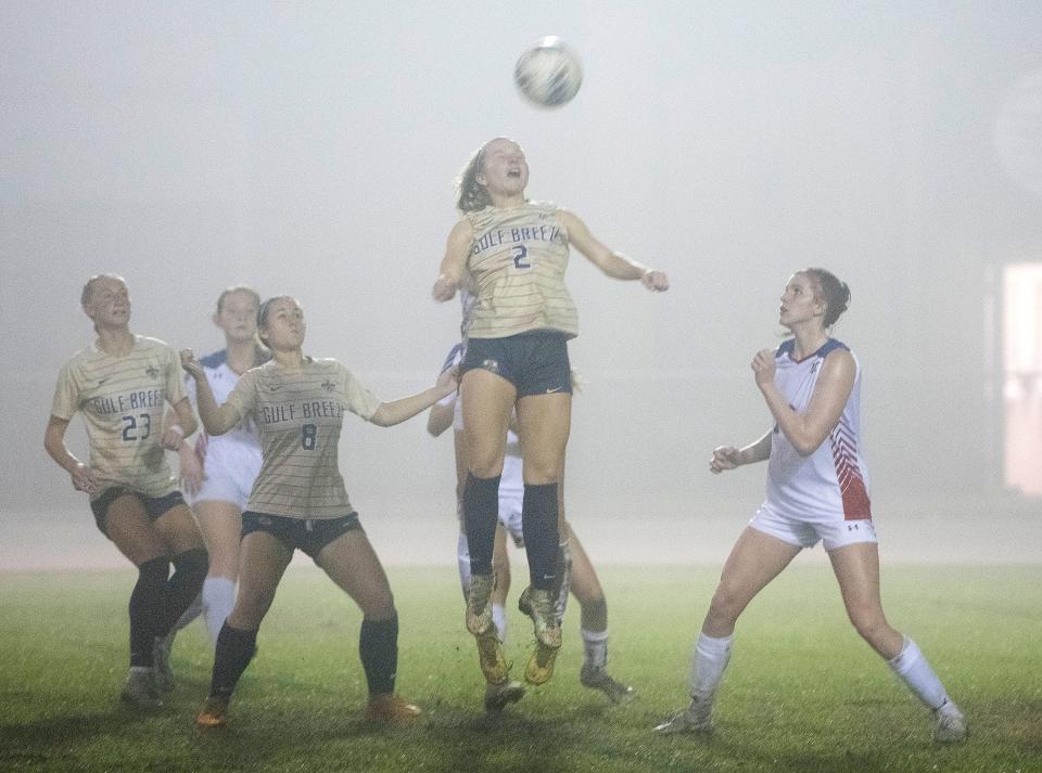 Gulf Breeze High's Addi Stikeleather (No. 2) picks up the header on the Pace High School end of the field during Tuesday's District 1-6A tournament at Navarre High. 