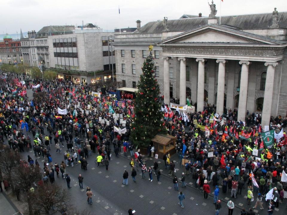 Thousands of anti-austerity protesters rally outside Dublin's General Post Office to hear speeches opposing government plans for more spending cuts and tax rises Saturday, Nov. 24, 2012. The government says it will unveil Ireland's sixth straight austerity budget next month in hopes of reducing the country's 2013 deficit to 8.6 percent, still nearly triple the spending limit that eurozone members are supposed to observe. (AP Photo/Shawn Pogatchnik)