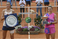 Romania's Simona Halep, right, poses with runner-up Czech Republic's Karolina Pliskova after winning their final match at the Italian Open tennis tournament, in Rome, Monday, Sept. 21, 2020. (Alfredo Falcone/LaPresse via AP)