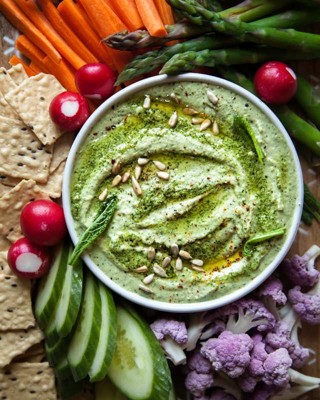 <p>The First Mess</p><p>Creamy kale pesto white bean dip is a delicious, super savoury, slightly cheesy, vegan, and nut-free appetizer that everyone will enjoy.</p><p><strong>Get the recipe: <a href="https://thefirstmess.com/2019/04/03/vegan-creamy-kale-pesto-white-bean-dip-recipe/" rel="nofollow noopener" target="_blank" data-ylk="slk:Vegan Creamy Kale Pesto White Bean Dip;elm:context_link;itc:0;sec:content-canvas" class="link "><em>Vegan Creamy Kale Pesto White Bean Dip</em></a></strong></p>