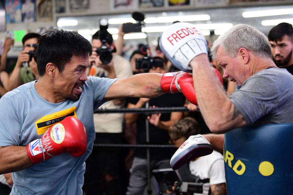 Eight-division world champion boxer Manny Pacquiao (L) spars with coach Freddy Roach in Hollywood, California on July 10, 2019. - Pacquiao is training ahead of his July 20 bout against Welterweight World Champion Keith Thurman. (Photo by FREDERIC J. BROWN / AFP)        (Photo credit should read FREDERIC J. BROWN/AFP/Getty Images)