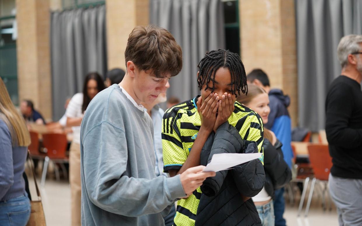 Two boys at Nottingham High School receive their results on Thursday