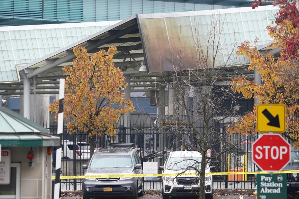 Fire damage is visible to the customs plaza structure at the Rainbow Bridge border crossing (AP)