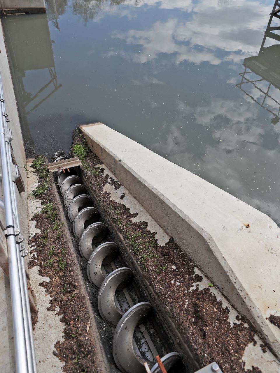 An open screw pump removes solid waste from a pretreatment grit tank into the Headworks building at the Akron Water Reclamation Facility.