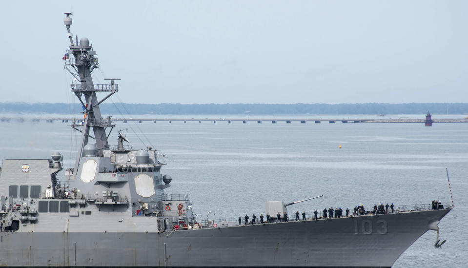 This image provided by the US Navy shows the USS Truxtun (DDG-103) an Arleigh Burke-class destroyer as it heads out of the it's berth at Naval Station Norfolk ahead of Hurricane Dorian in Norfolk, Va., Wednesday Sept. 4, 2019. The U.S. Navy has ordered ships based on Virginia's coast to head out to sea to avoid Hurricane Dorian. (Alton Dunham/US Navy via AP)