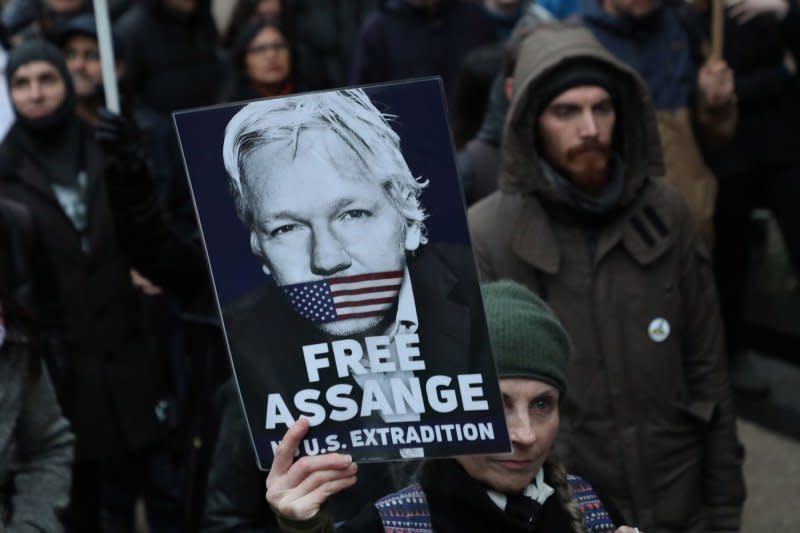 Supporters of Julian Assange march against his extradition to the United States at the Royal Courts of Justice in London on Wednesday. The two day hearing in front of a judge is the last chance for Julian Assange to gain an appeal to stop his extradition. Photo by Hugo Philpott/UPI