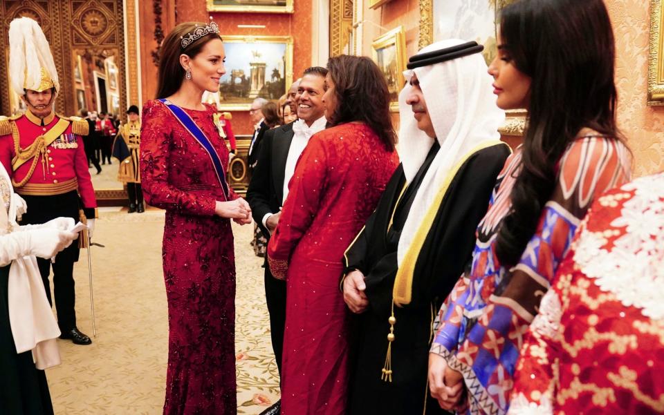 Kate greets diplomats at Buckingham Palace - PA