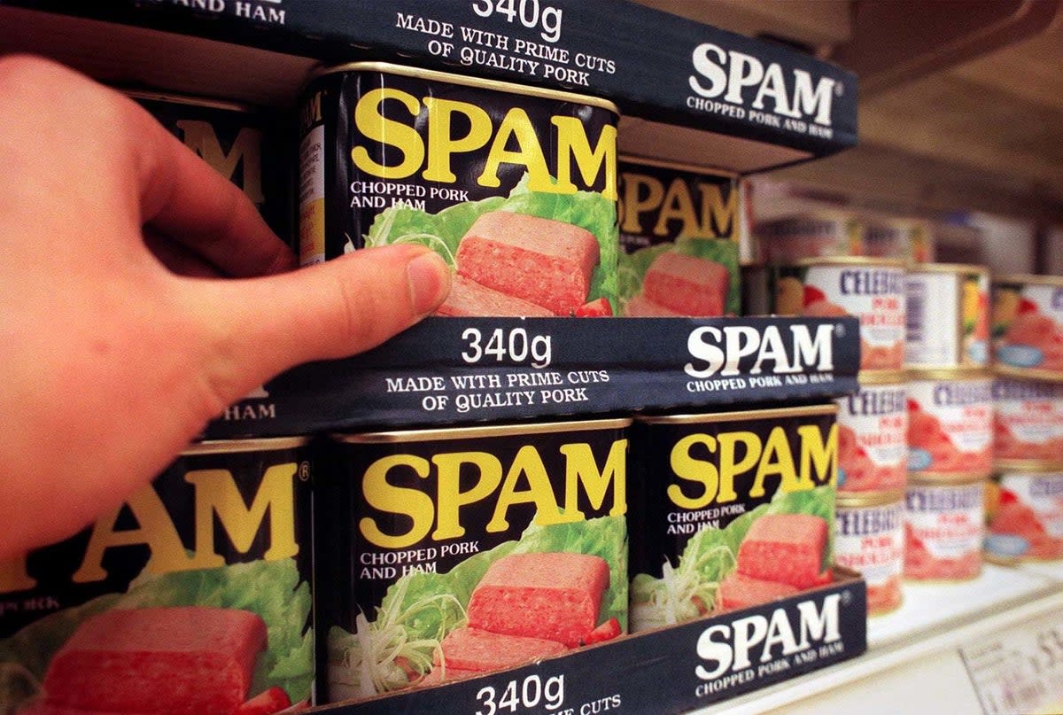 Spam … best seen on supermarket shelves (PA)