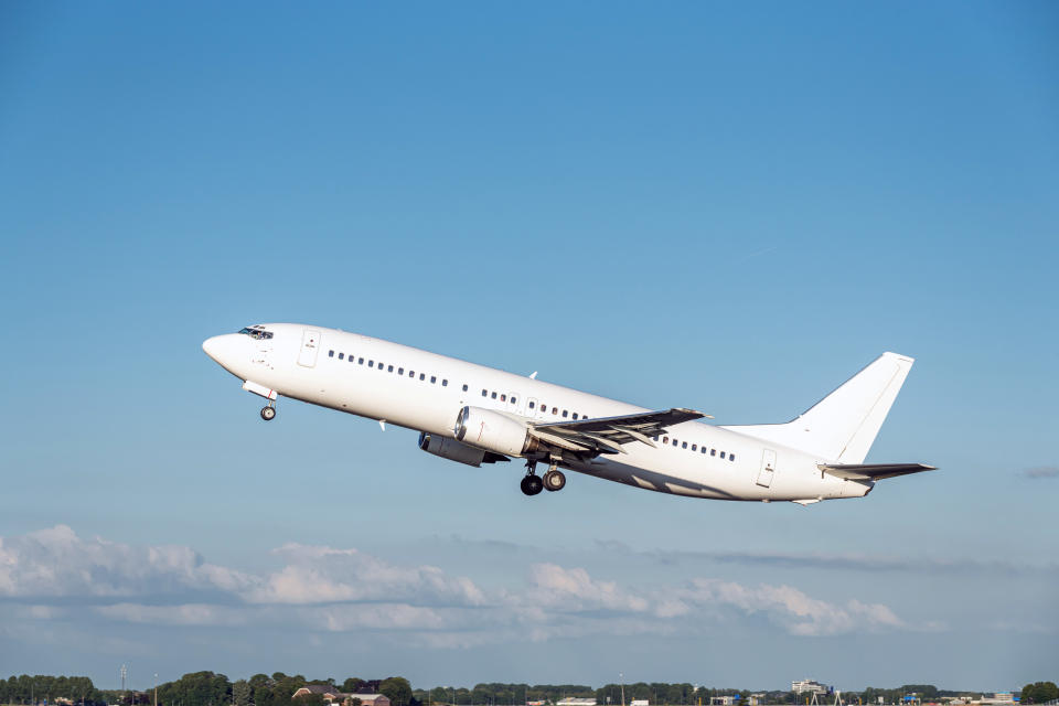 Pictured is a plane jetting off into a clear blue sky. 