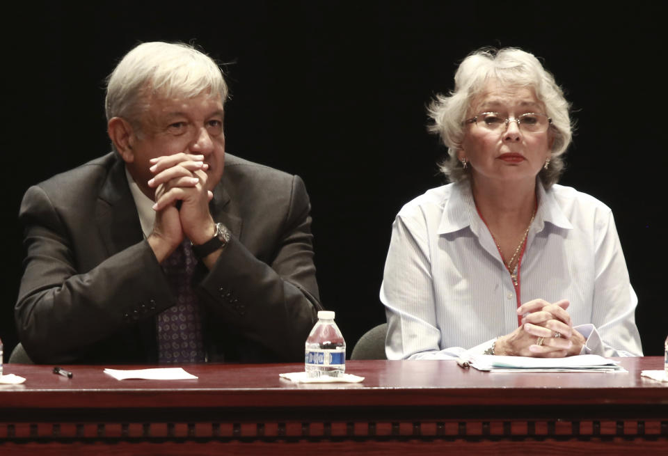 FILE - In this Aug. 7, 2018 file photo, Mexico's President-elect Andres Manuel Lopez Obrador and incoming Interior Secretary Olga Sanchez attend a meeting on security and national reconciliation, in Ciudad Juarez, Mexico. Mexico's incoming government says it does not plan to assume the role of "safe third country" for migrants seeking asylum in the U.S. after Lopez Obrador is sworn in as president on Dec. 1. (AP Photo/Christian Torres, File)