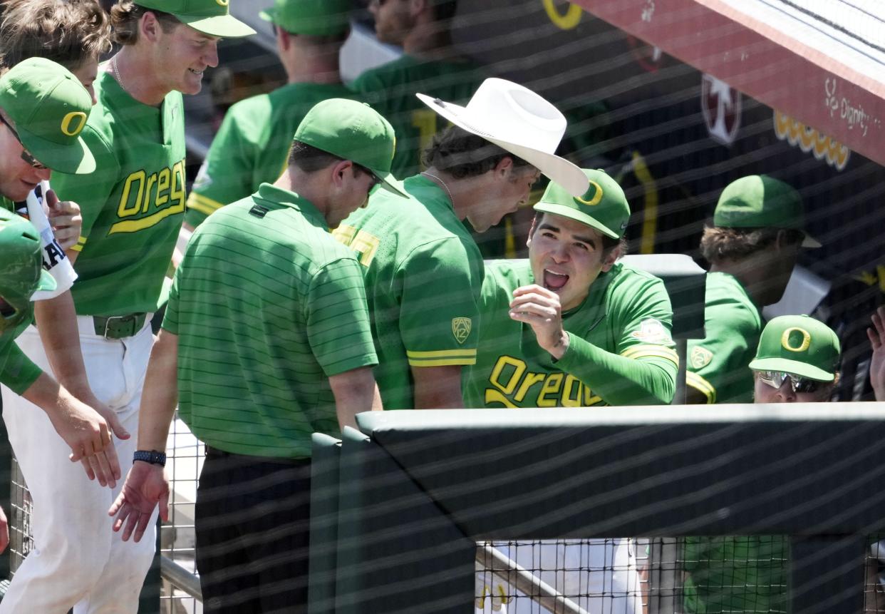 May 25, 2022; Scottsdale, Arizona, USA; Oregon Ducks Anthony Hall (35) wears a cowboy hat after hitting a three-run home run off Arizona Wildcats pitcher Chris Barraza in the sixth inning during the Pac-12 Baseball Tournament at Scottsdale Stadium.