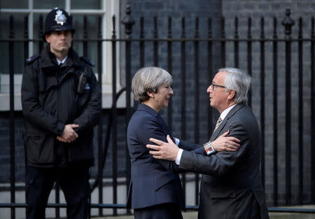 Britain's Prime Minister Theresa May welcomes Head of the European Commission, President Jean-Claude Juncker to Downing Street in London, Britain April 26, 2017. REUTERS/Hannah McKay