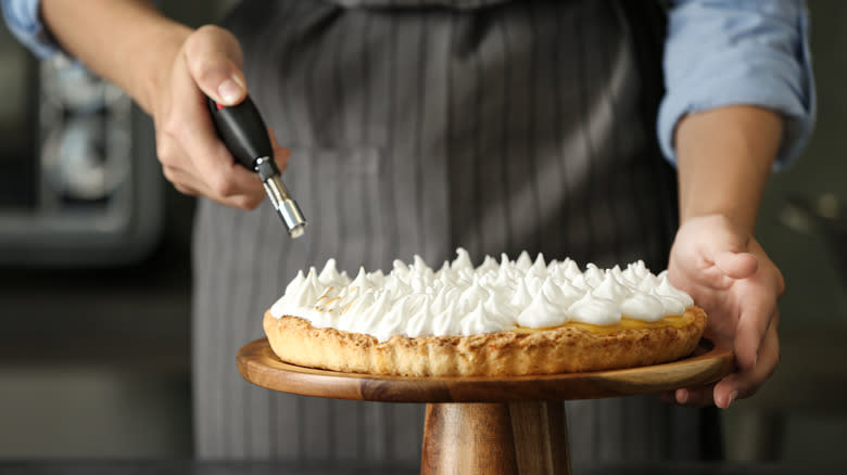 Toasting meringue on pie
