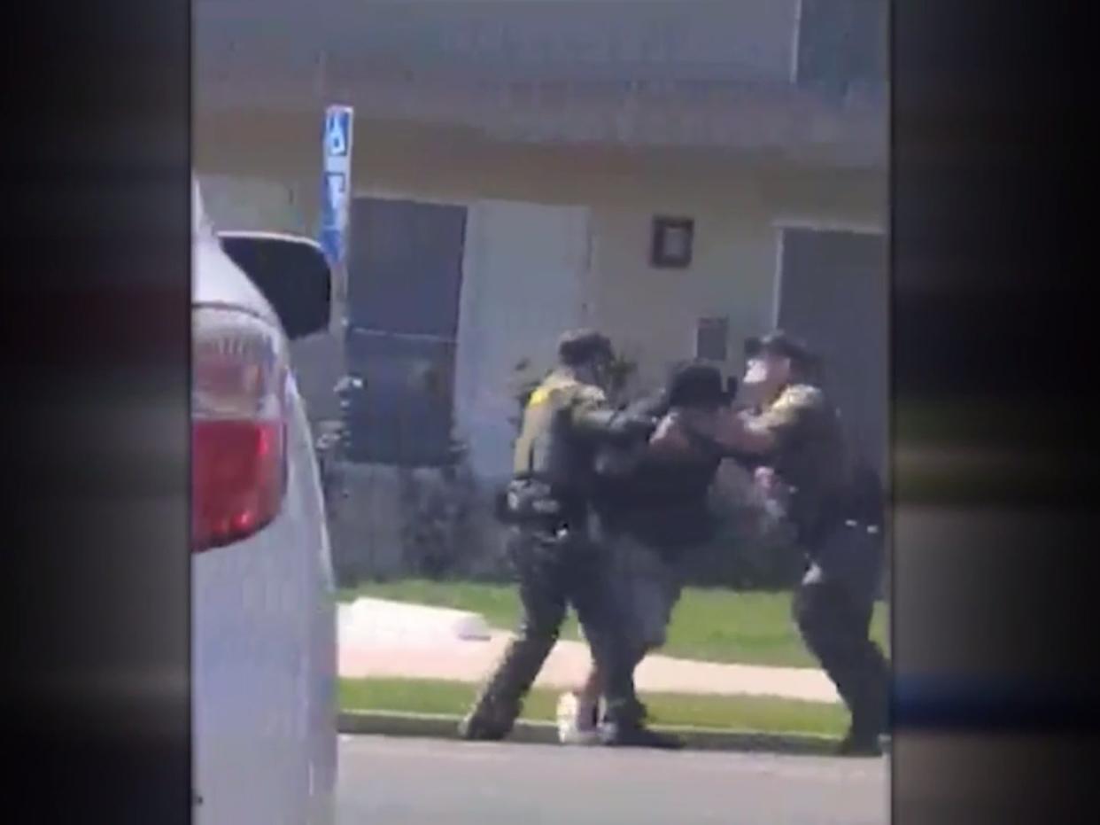 <p>Video showing the moment sheriff’s deputies tackle and shot a homeless man for jaywalking </p> (Orange County Sheriffs Department / Local 12 News)