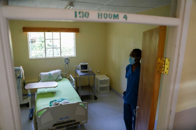 A medical staff member stands in an empty isolation room as the hospital prepares for the coronavirus disease (COVID-19) outbreak, at the Karen hospital near Nairobi