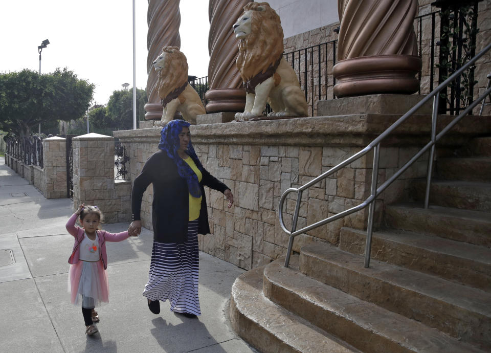 Worshipers enter a branch of La Luz del Mundo church for a service Thursday, June 6, 2019, in Los Angeles. California's top prosecutor said Thursday that he believes there are more victims of child sex abuse than those listed in charges against the leader of Mexico-based megachurch La Luz del Mundo and several followers. (AP Photo/Marcio Jose Sanchez)