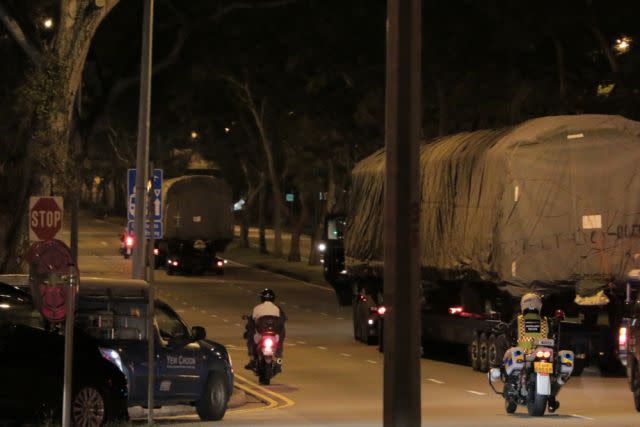 Shrouded train cars leave Singapore’s Bishan Depot on the morning of June 12. <span class="inline-image-credit">(FactWire, used with permission)</span>