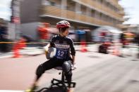 <p>A woman competed in Kyontanabe, Japan's Chair-One Grand Prix in March 2016, an annual event in which racers fly through the streets on office chairs. </p>