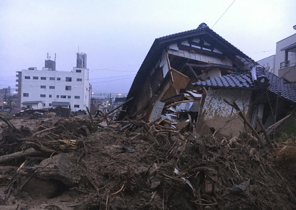 <p>Debris fills a small village following heavy rains on July 8, 2018, in Kuchita-Minami, Asakita-ku, Hiroshima, Japan. Searches continued Sunday night for dozens of victims still missing from the heavy rainfall that hammered southern Japan for the third straight day. (Photo: Haruka Nuga/AP) </p>