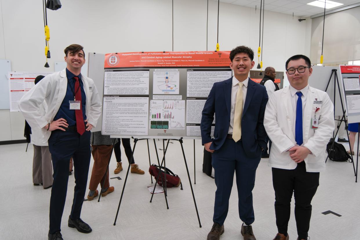 Jankiss Maher, left, Titus Lie, and Henry Ng stand with their research presentation Friday at the inaugural Amarillo Research Symposium at the Texas Tech School of Veterinary Medicine in Amarillo.