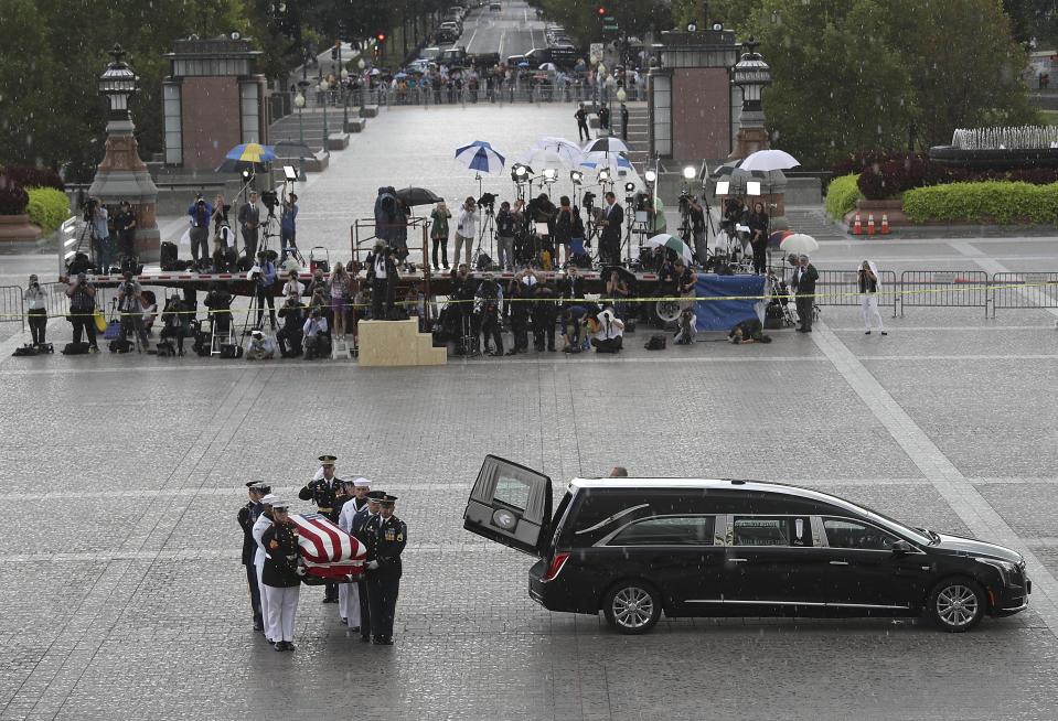 The flag-draped casket of Sen. John McCain, R-Ariz., is carried into the U.S. Capitol, Friday, Aug. 31, 2018, in Washington. (Win McNamee/Pool photo via AP)