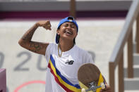 Margielyn Didal of Philippines reacts after completing a trick in the women's street skateboarding finals at the 2020 Summer Olympics, Monday, July 26, 2021, in Tokyo, Japan. (AP Photo/Ben Curtis)