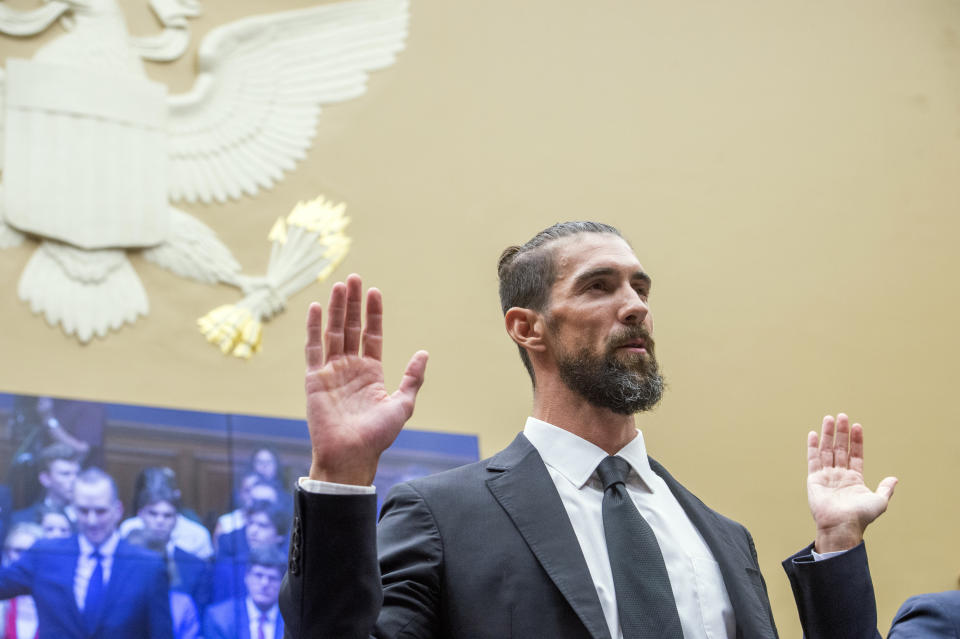 Michael Phelps, former Olympic athlete is sworn in during a House Committee on Energy and Commerce | Subcommittee on Oversight and Investigations examining Anti-Doping Measures in Advance of the 2024 Olympics, on Capitol Hill, Tuesday, June 25, 2024, in Washington. (AP Photo/Rod Lamkey, Jr.)