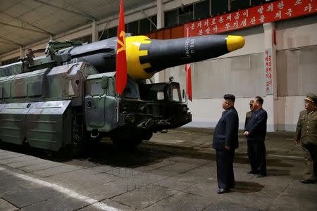 North Korean leader Kim Jong Un inspects the long-range strategic ballistic rocket Hwasong-12 (Mars-12) in this undated photo released by North Korea's Korean Central News Agency (KCNA) on May 15, 2017. KCNA via REUTERS/Files